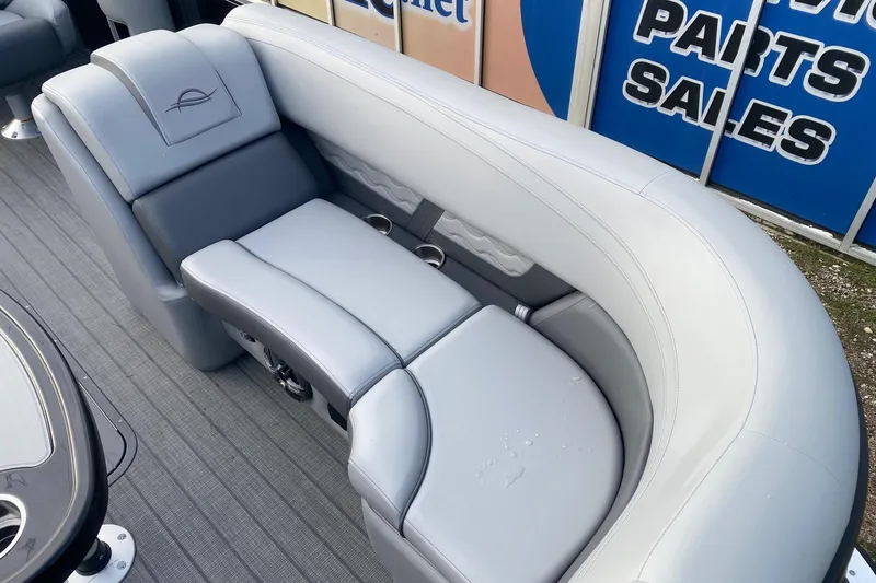 Slide: The Image of Luxurious seating on 2026 SunCatcher Fusion 322SS boat, featuring sleek gray upholstery. - 7