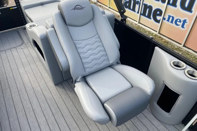 Slide: The Image of Luxurious seating on 2026 SunCatcher Fusion 322SS boat, featuring sleek gray upholstery. - 9