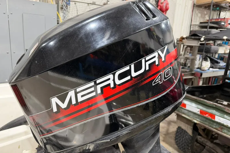 Slide: The Image of Mercury 40 outboard motor on a 1998 Boston Whaler Dauntless 13 boat. - 9