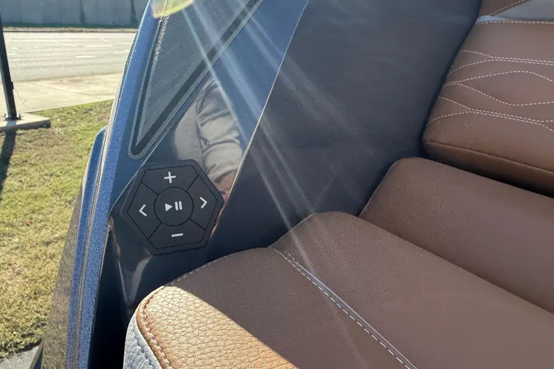 Slide: The Image of 2026 Supra SL 550 interior with brown leather seats and control panel. - 16