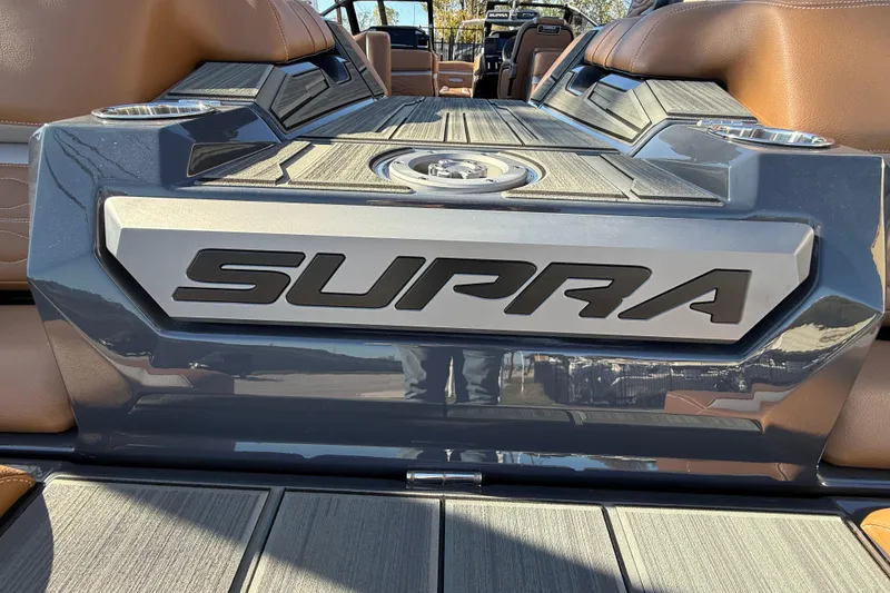 Slide: The Image of 2026 Supra SL 550 boat interior with logo and luxurious seating. - 19
