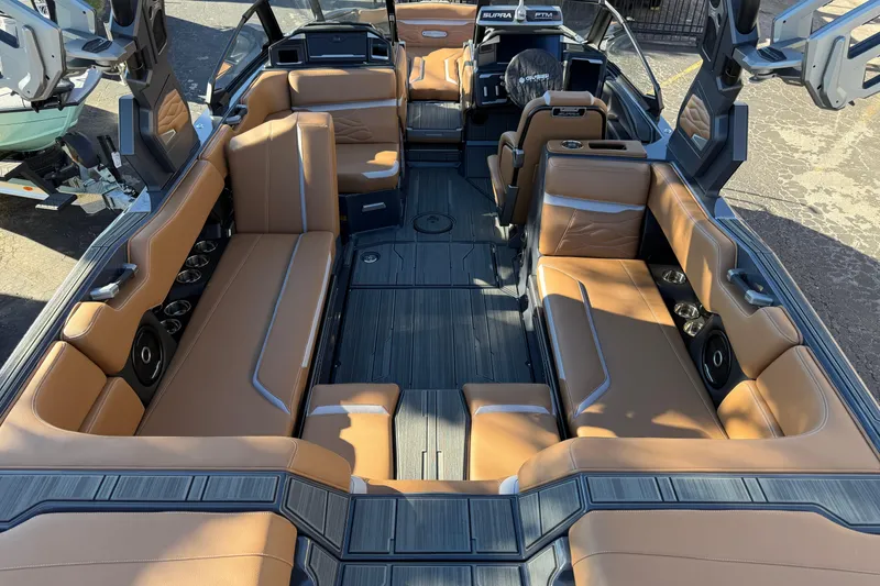 Slide: The Image of Luxurious interior of 2026 Supra SL 550 boat with tan leather seating and modern design. - 20