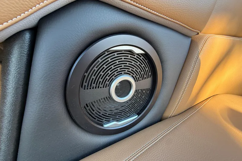 Slide: The Image of 2026 Supra SL 550 interior speaker with brown leather upholstery. - 26