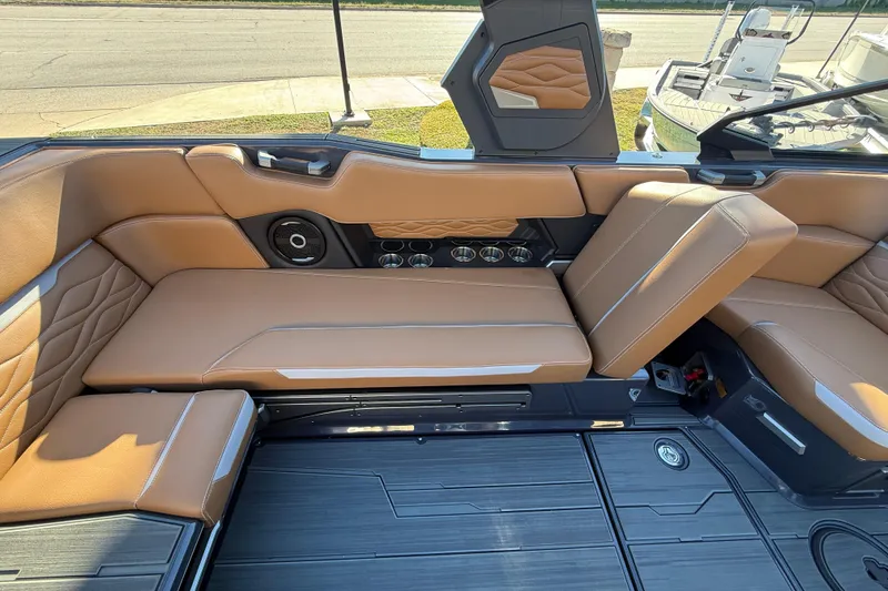 Slide: The Image of 2026 Supra SL 550 boat interior with tan leather seating and modern design. - 29