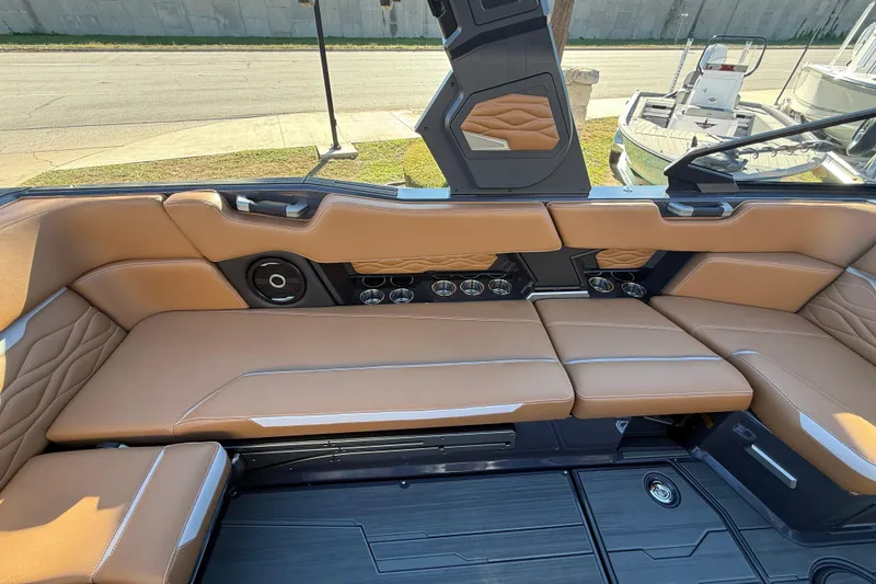 Slide: The Image of Luxurious interior of 2026 Supra SL 550 boat with tan leather seating and modern design. - 30