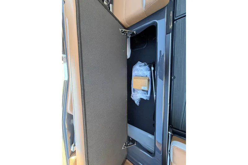 Slide: The Image of 2026 Supra SL 550 interior storage compartment with packaging materials. - 31