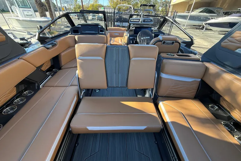 Slide: The Image of Luxurious interior of 2026 Supra SL 550 boat with tan leather seating and modern design. - 33