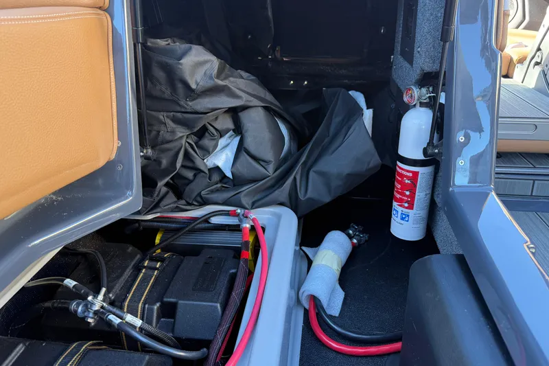 Slide: The Image of 2026 Supra SL 550 interior storage with fire extinguisher and cables. - 36