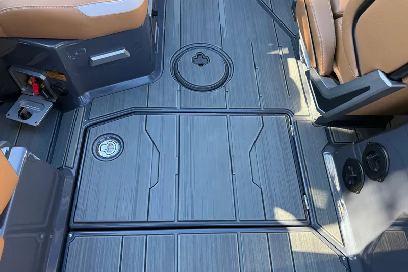 Slide: The Image of 2026 Supra SL 550 boat interior with sleek, modern flooring and tan seating. - 40