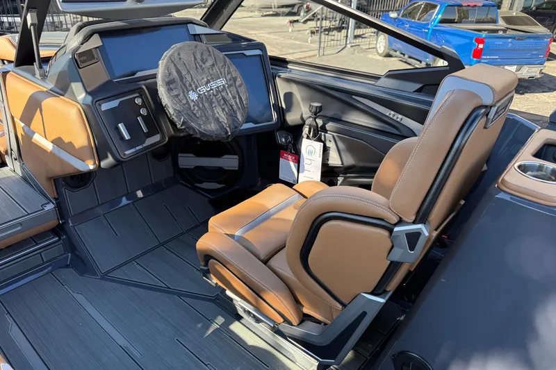 Slide: The Image of 2026 Supra SL 550 boat interior with brown leather seats and modern dashboard. - 42