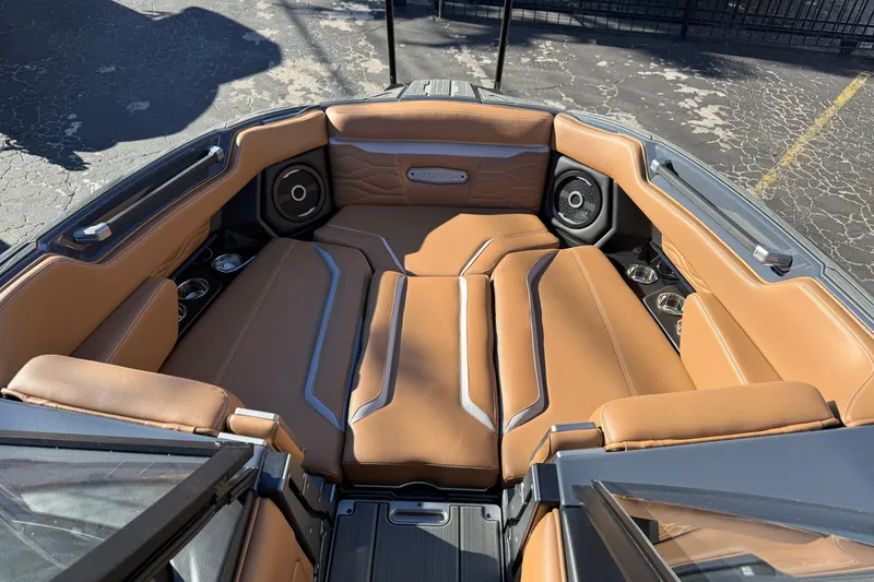 Slide: The Image of Luxurious interior of 2026 Supra SL 550 boat with tan leather seating and speakers. - 52