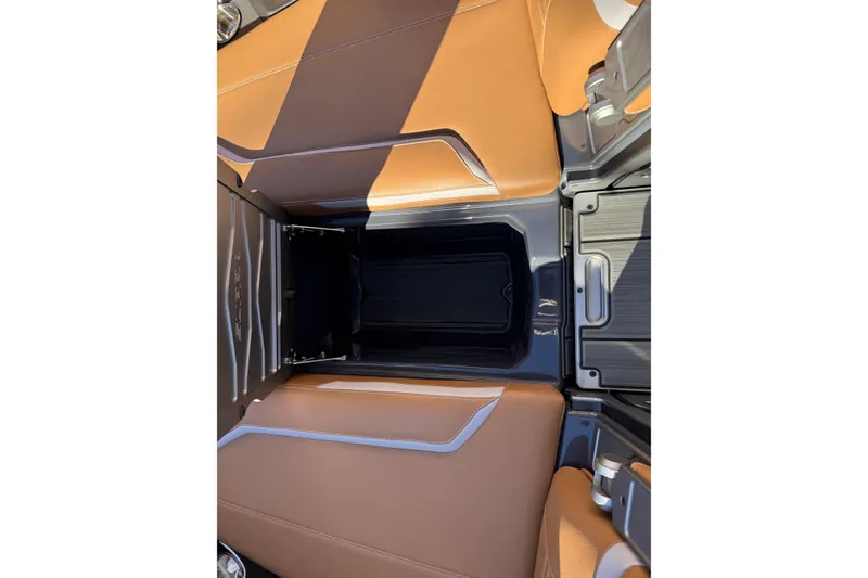 Slide: The Image of 2026 Supra SL 550 interior with tan leather seats and sleek console design. - 53