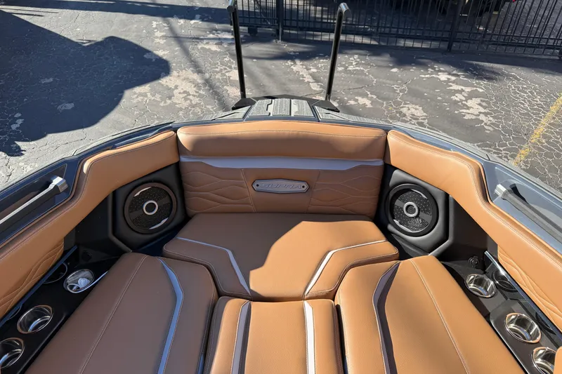 Slide: The Image of Luxurious interior of 2026 Supra SL 550 boat with tan leather seating and speakers. - 54