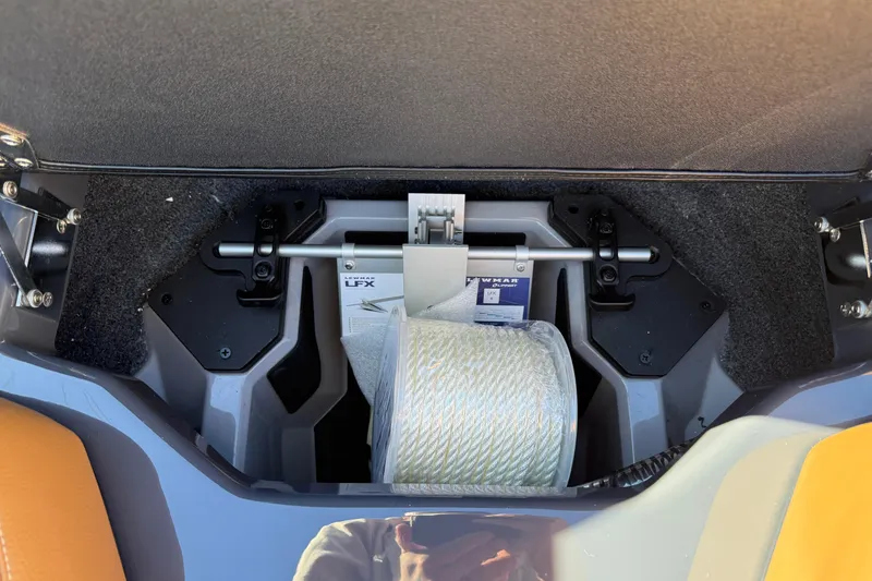Slide: The Image of 2026 Supra SL 550 storage compartment with rope and accessories. - 55