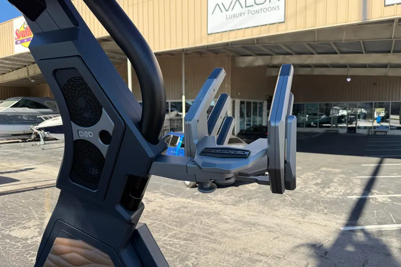 Slide: The Image of 2026 Supra SL 550 boat tower with speakers and board rack at dealership. - 57