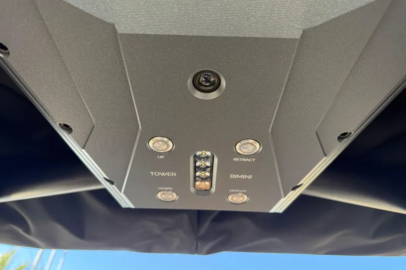 Slide: The Image of Control panel of 2026 Supra SL 550 boat with tower and bimini buttons. - 59