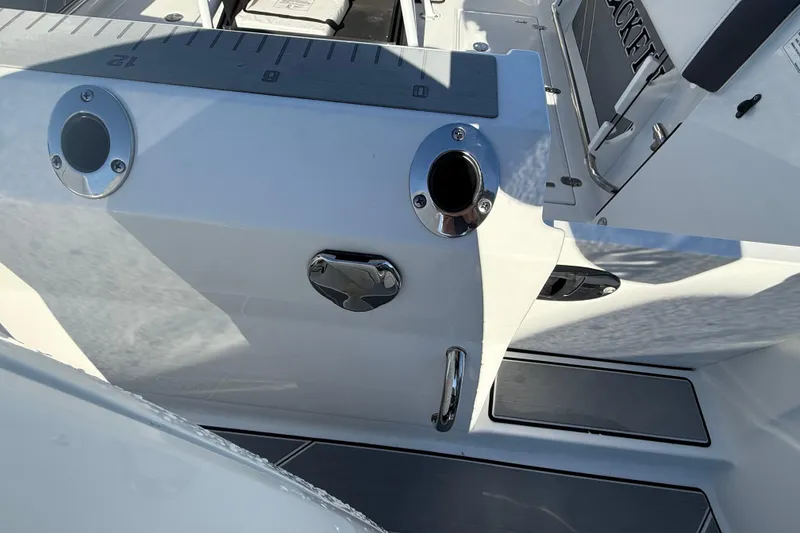 Slide: The Image of 2022 Blackfin 252 CC boat deck with rod holders and seating area. - 10