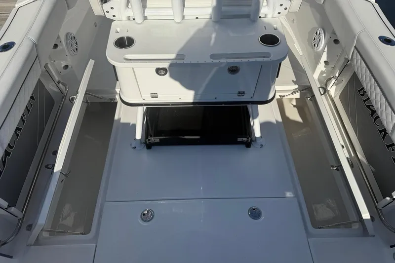 Slide: The Image of Interior of a 2022 Blackfin 252 CC boat with storage compartments. - 18