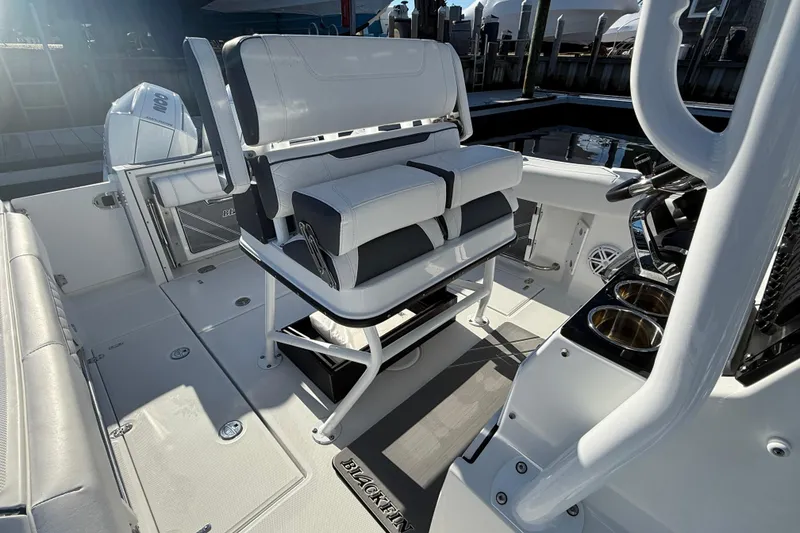 Slide: The Image of 2022 Blackfin 252 CC boat interior with seating and console details. - 19