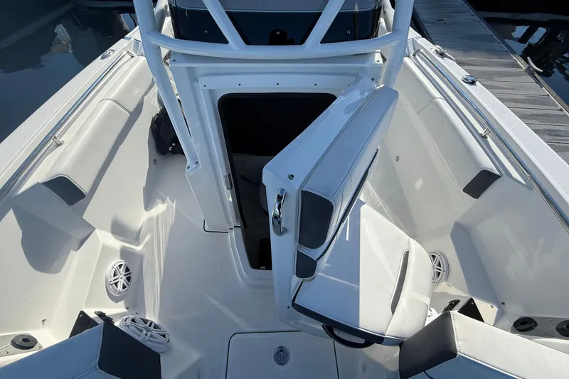 Slide: The Image of 2022 Blackfin 252 CC boat interior with open storage compartment and seating. - 31