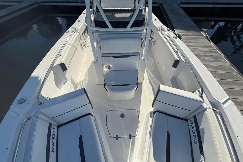 Slide: The Image of 2022 Blackfin 252 CC boat interior with white seating and sleek design. - 35