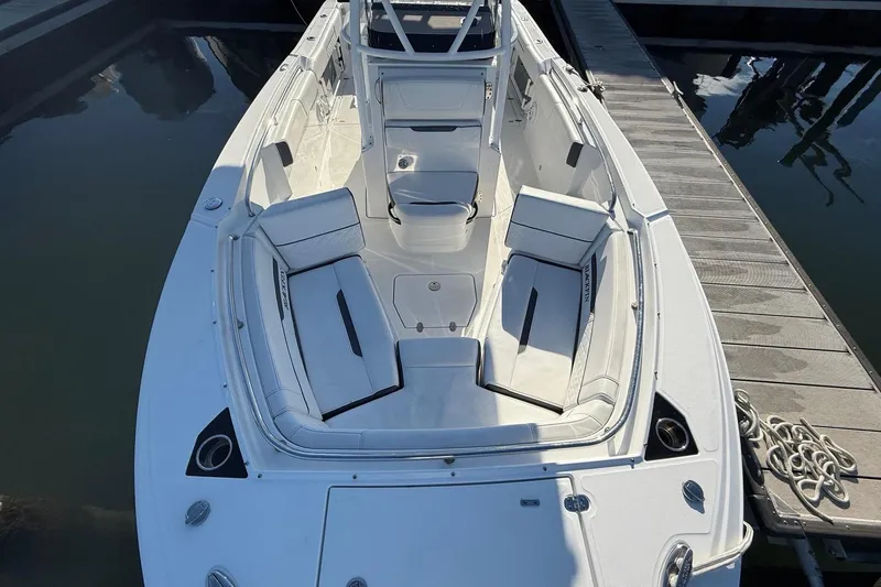 Slide: The Image of 2022 Blackfin 252 CC boat docked with luxurious interior seating. - 39