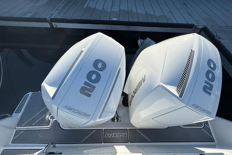 Slide: The Image of Two Mercury engines on a 2022 Blackfin 252 CC boat. - 4