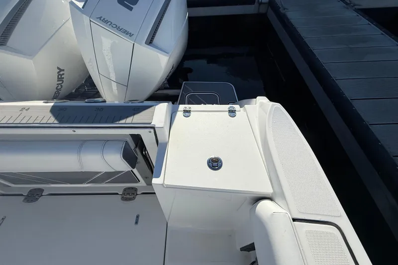 Slide: The Image of 2022 Blackfin 252 CC boat with Mercury engines docked at marina. - 8