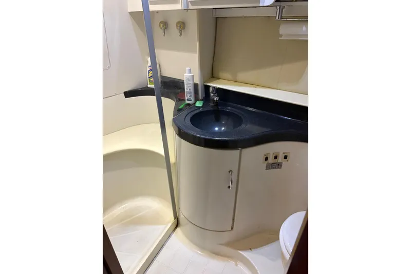 Slide: The Image of Bathroom interior of 2005 Carver 41 Cockpit Motor Yacht with sink and shower. - 10