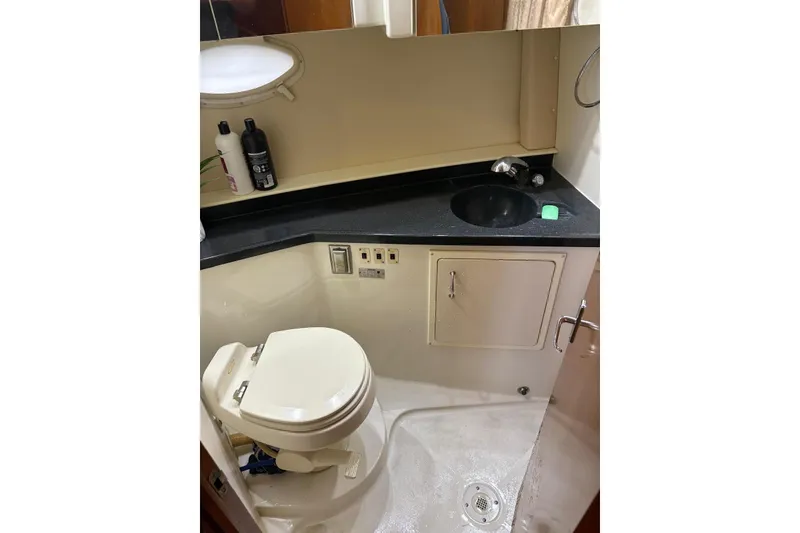 Slide: The Image of Bathroom of 2005 Carver 41 Cockpit Motor Yacht with toilet and sink. - 14