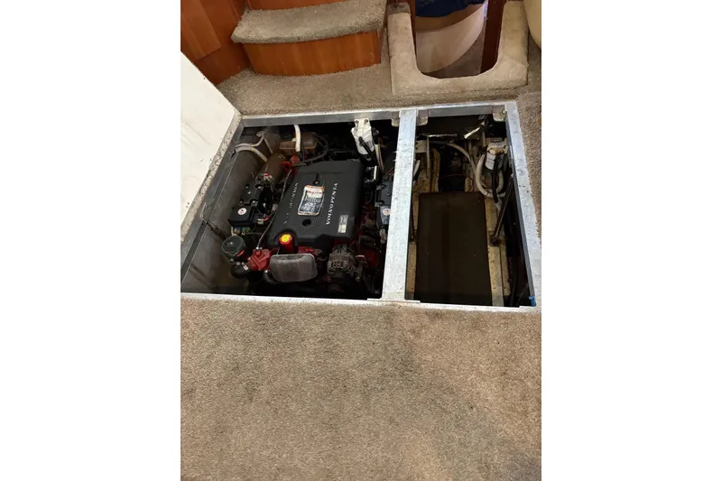 Slide: The Image of Engine compartment of 2005 Carver 41 Cockpit Motor Yacht, featuring Volvo Penta engine. - 21