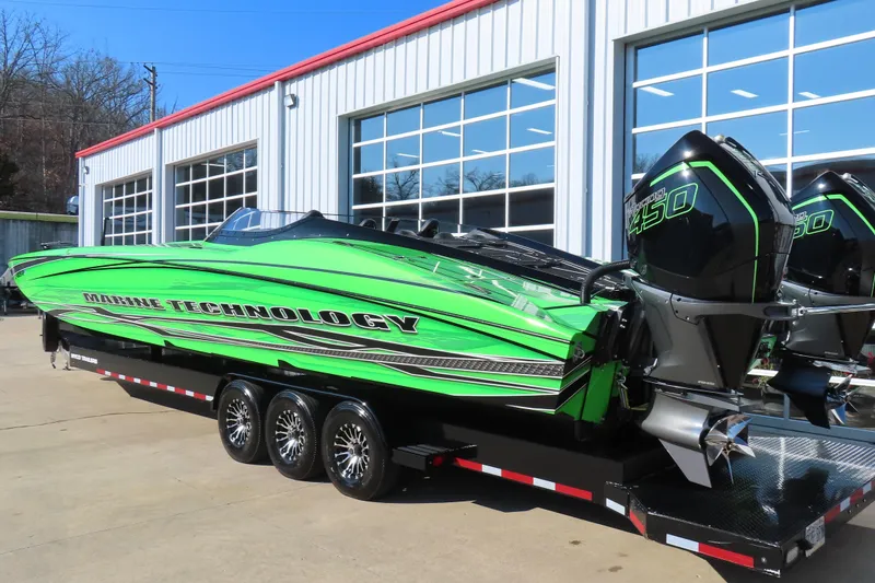 Slide: The Image of Green MTI 390X powerboat with dual engines on a trailer, 2023 model. - 10