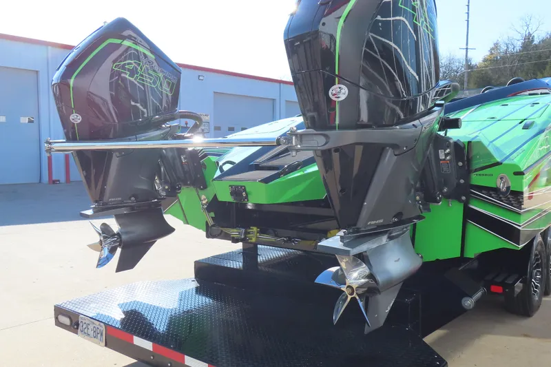Slide: The Image of 2023 MTI 390X boat with dual Mercury 450R outboard engines on a trailer. - 16
