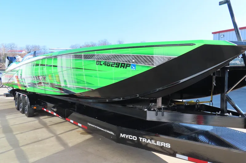 Slide: The Image of 2023 MTI 390X powerboat in vibrant green on Myco trailer. - 17