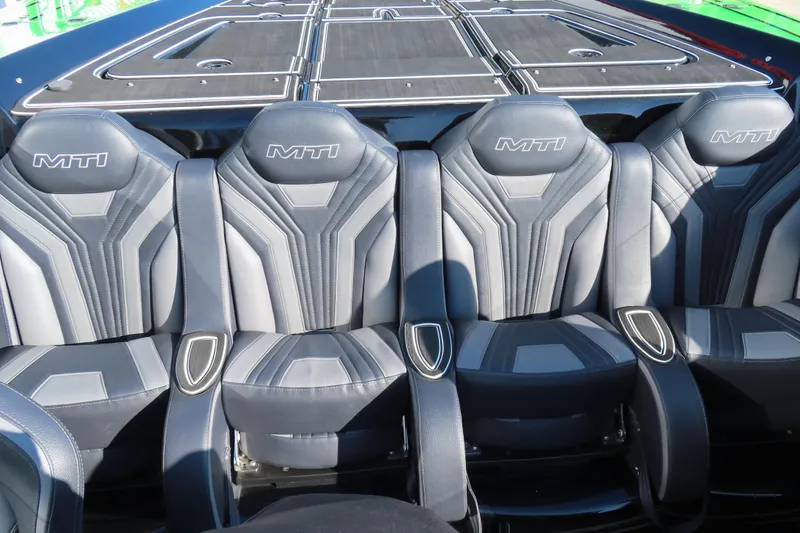 Slide: The Image of 2023 MTI 390X boat seats with sleek, modern design and MTI branding. - 21