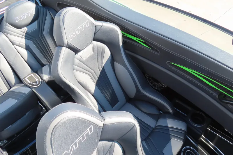 Slide: The Image of Luxurious MTI 390X 2023 boat interior with sleek black and green accents. - 30