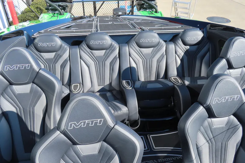 Slide: The Image of Luxurious 2023 MTI 390X boat interior with sleek, modern seating design. - 31