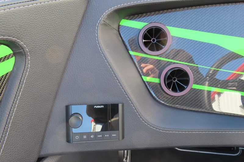 Slide: The Image of Dashboard of 2023 MTI 390X with Fusion audio controls and carbon fiber accents. - 32