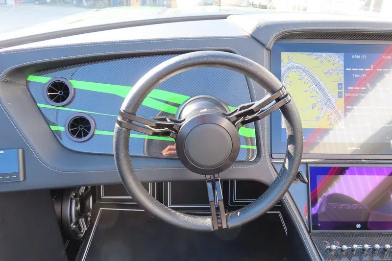 Slide: The Image of 2023 MTI 390X dashboard with modern steering wheel and digital display. - 33