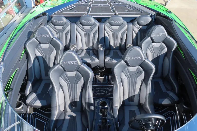 Slide: The Image of Interior of 2023 MTI 390X boat with sleek gray seating and modern design. - 36