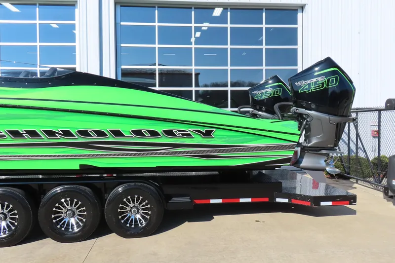 Slide: The Image of Green MTI 390X 2023 powerboat with twin Mercury Racing 450 engines on a trailer. - 39