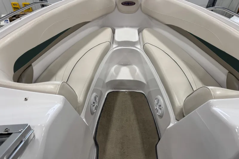Slide: The Image of 1999 Four Winns 220 Horizon SS boat interior with beige seating and carpet. - 10