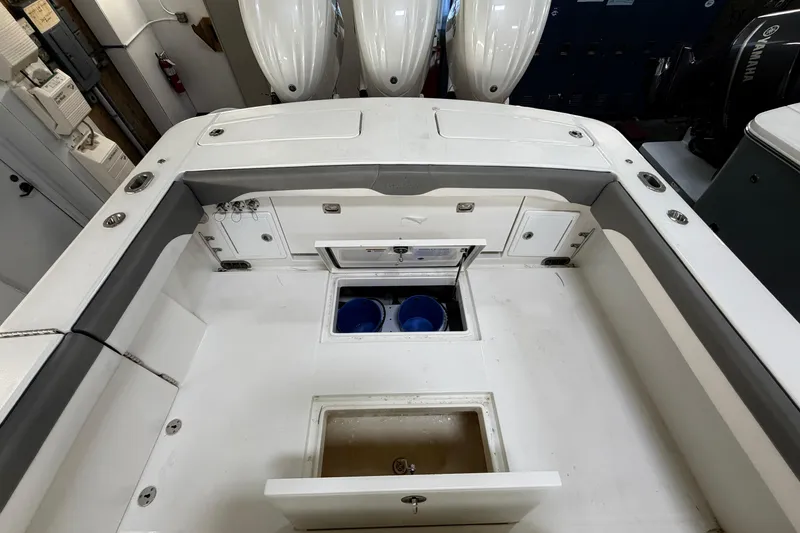 Slide: The Image of 2024 Regulator 34 boat interior with storage compartments and seating. - 15