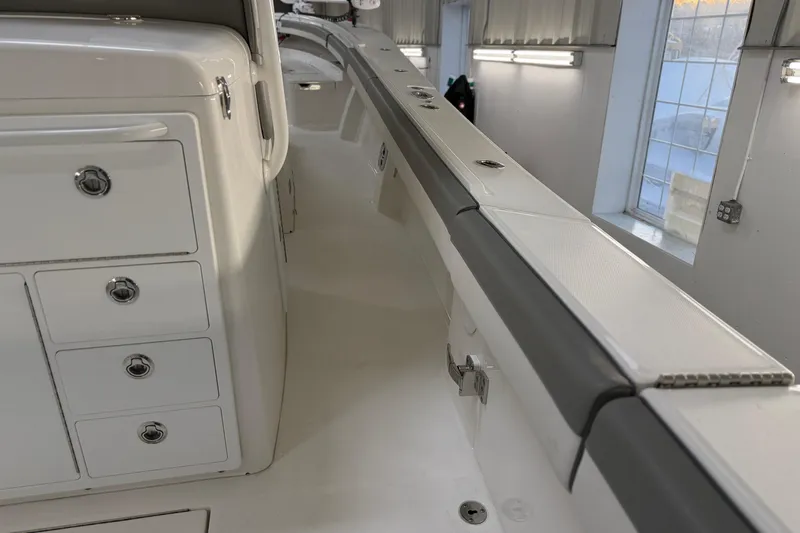 Slide: The Image of 2024 Regulator 34 boat interior with storage compartments and sleek design. - 20