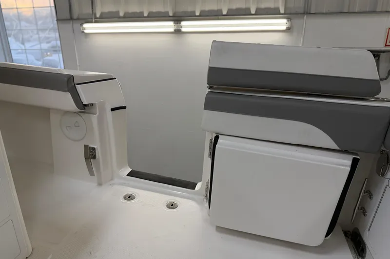 Slide: The Image of 2024 Regulator 34 boat interior with seating and storage compartments. - 21