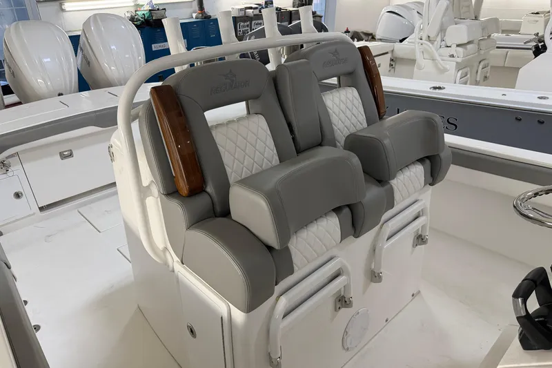 Slide: The Image of 2024 Regulator 34 boat interior with luxurious gray and white seating. - 32