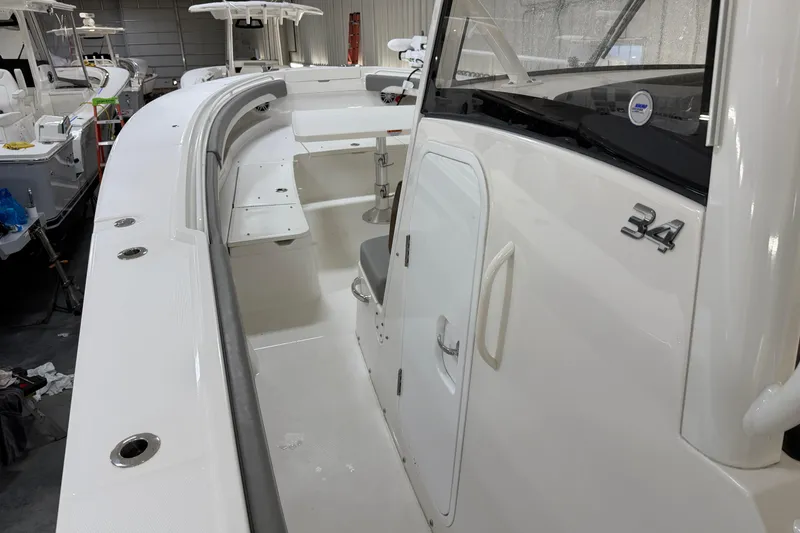 Slide: The Image of 2024 Regulator 34 boat interior with sleek white design and modern features. - 35