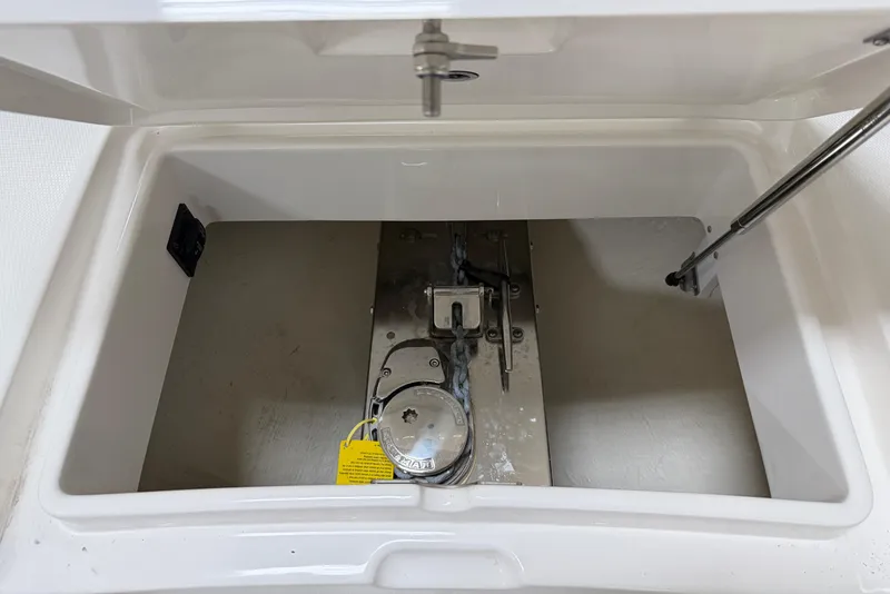 Slide: The Image of 2024 Regulator 34 boat storage compartment with mechanical components. - 40