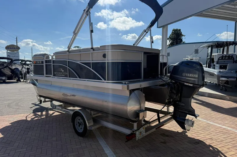 Slide: The Image of 2019 Bennington 188 SLV pontoon boat with Yamaha engine on trailer. - 10