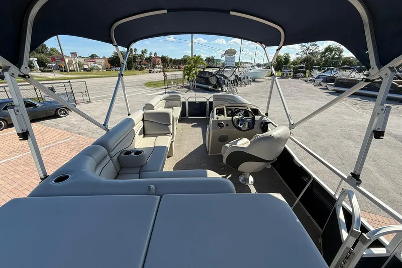 Slide: The Image of 2019 Bennington 188 SLV pontoon boat interior with seating and steering console. - 14